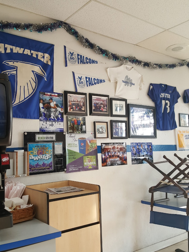 The inside of Atwater Sub Shop wall covered in Atwater High School memorabilia